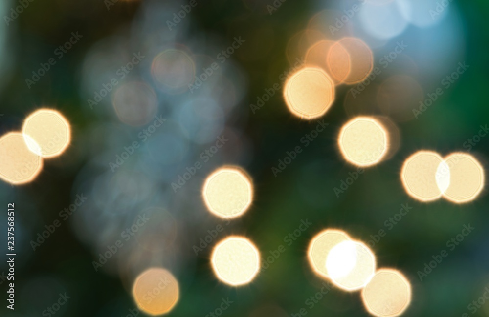 An abstract color image of bokeh Christmas lights from a Christmas tree. An abstract color image of bokeh Christmas lights from a Christmas tree.
