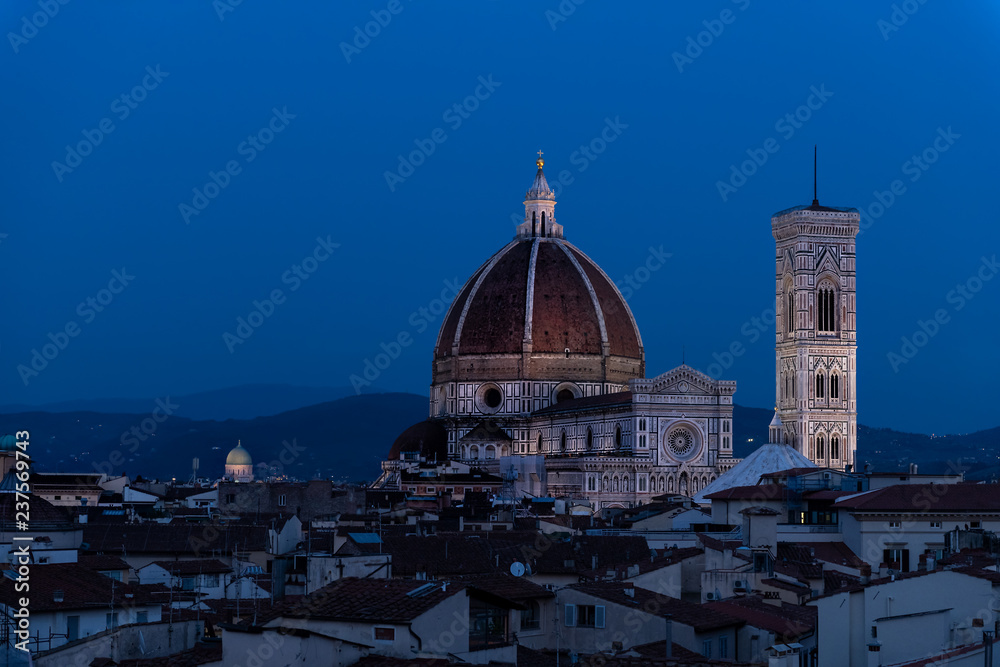Cityscape, skyline aerial view on Firenze, Italy, Italian city at dark night, twilight, dusk, houses, buildings roofs, rooftops, illuminated Florence Cathedral, Cattedrale di Santa Maria del Fiore