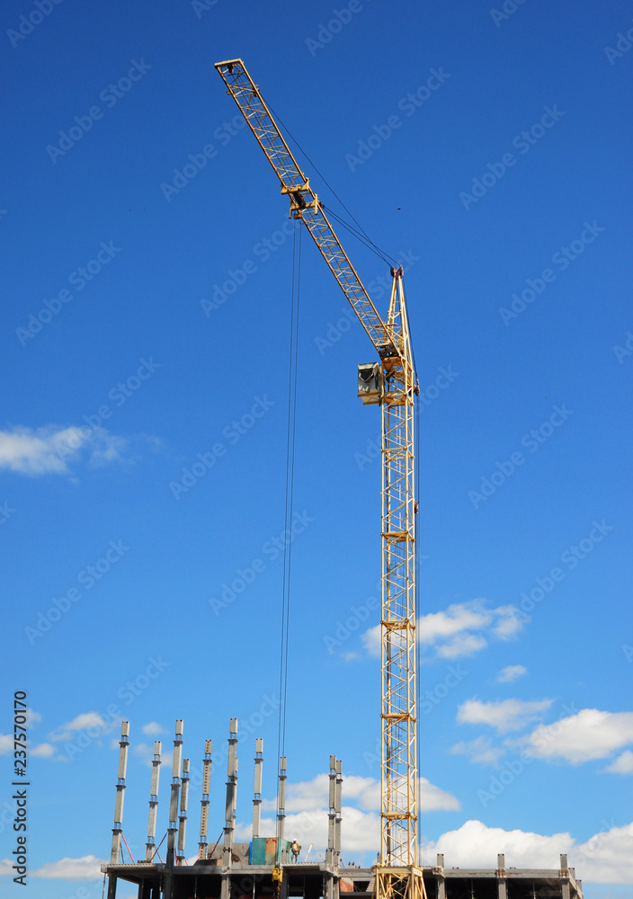 Crane Building New House on the Construction Site. Crane Building New House on the Construction Site.