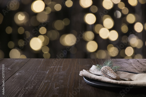 Christmas table setting and blurred bokeh light. Space for montage your christmas products.
