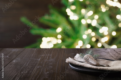 Christmas table setting and blurred bokeh light. Space for montage your christmas products.