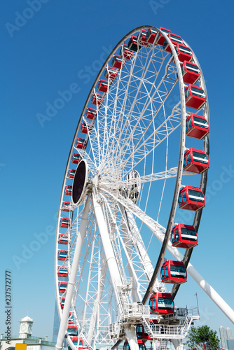 Ferris wheel and skyline of urban architecture in Hong Kong..