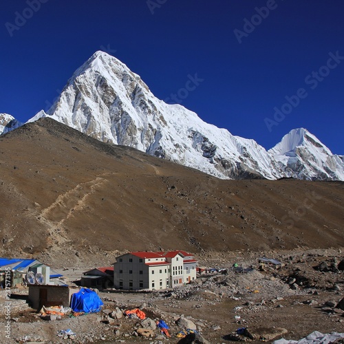 Hotels in Gorak Shep, last place before the Everest Base Camp. Snow capped Mount Pumori 7161 m and Kala Patthar.