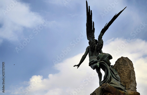 Turin, Piedmont region. Italy, September 2018. Piazza statuto, details of the monument dedicated to the Frejus Tunnel. It is located in the center of the square with a fountain that surrounds it. photo