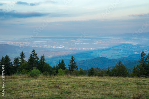 Germany, Sunrise over endless black forest valleys and hills from mountain