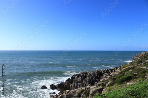 cliffs by the sea with blue sky
