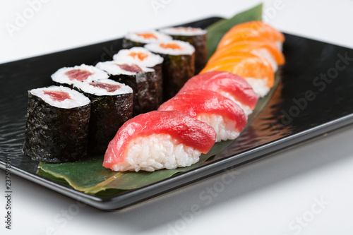 Tuna and salmon sashimi with sushi rolls