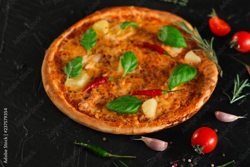 pizza, pineapples, chicken, tomato sauce, vegetables, basil (pizza ingredients). food background. copy space pizza, pineapples, chicken, tomato sauce, vegetables, basil (pizza ingredients). food background. copy space
