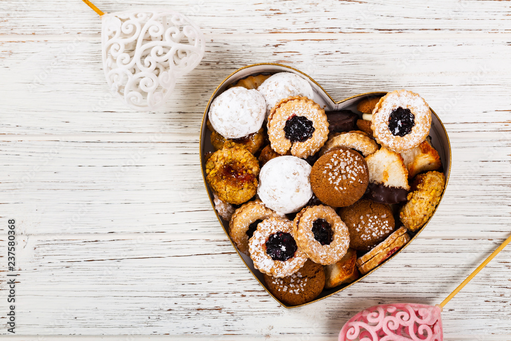 Valentines Day Card Background with Assorted Cookies over Wooden Background. Selective focus. Valentines Day Card Background with Assorted Cookies over Wooden Background. Selective focus.