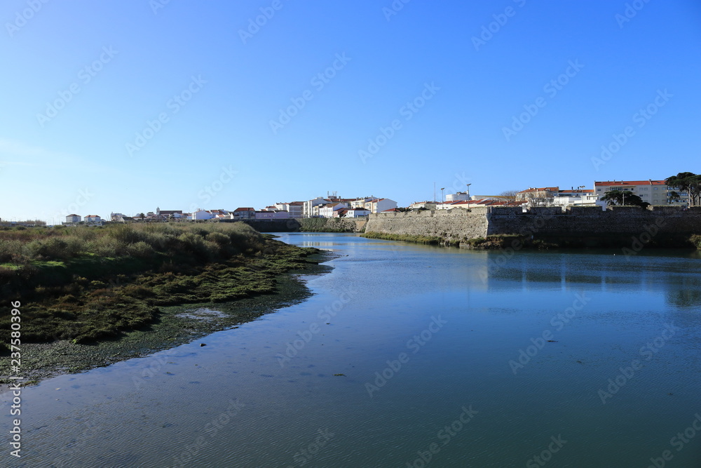 view of the city of Peniche and Portugal surrounded by water in the foreground