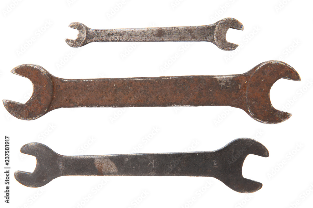 three old rusty wrench tools isolated on white background