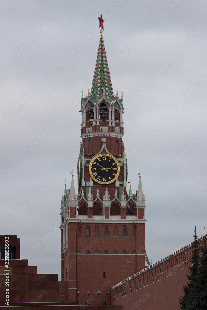 The clock of the Kremlin tower, the main clock of Russia in dark tones The clock of the Kremlin tower, the main clock of Russia in dark tones