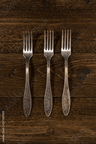Old cutlery. Top view On a wooden background, Copy space.