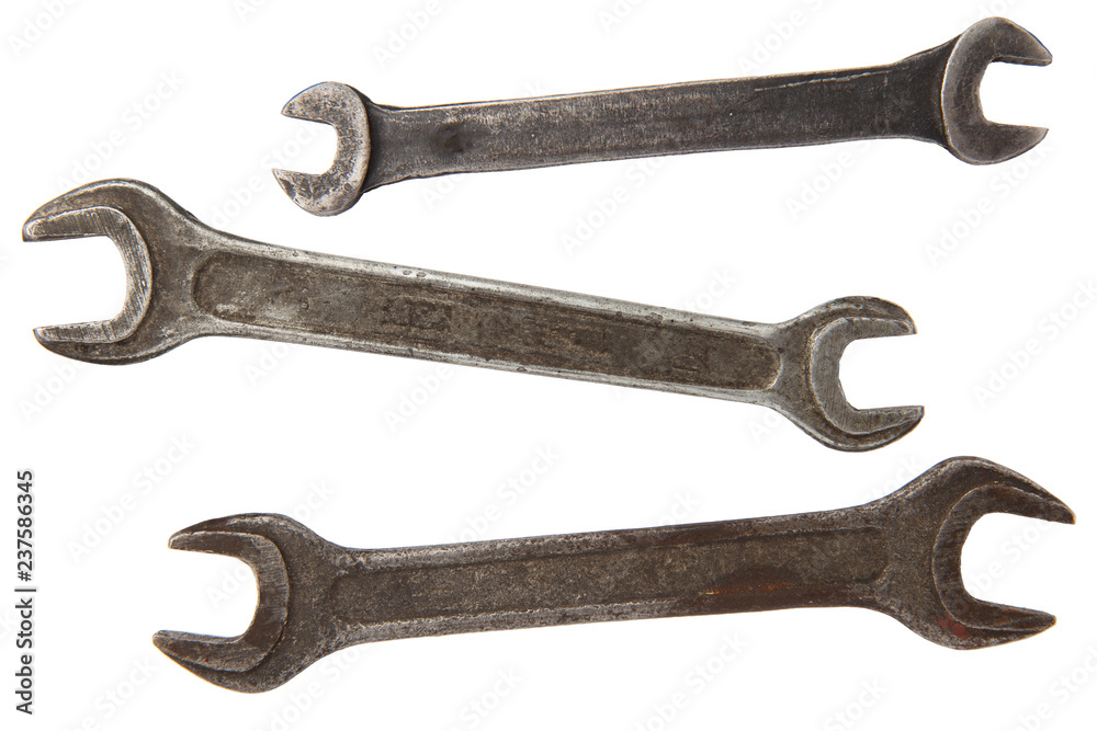 three old rusty wrench tools isolated on white background