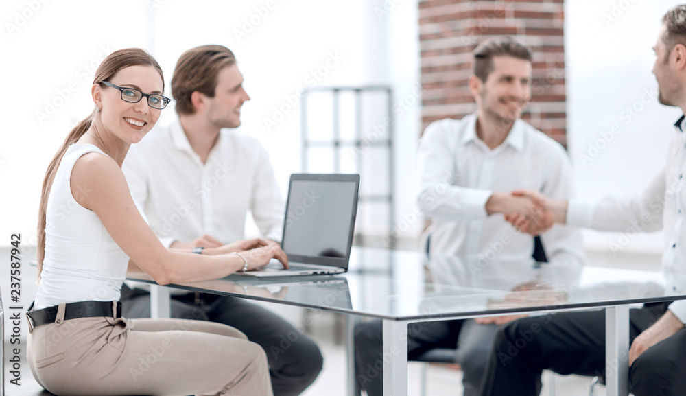 © ASDF - business people make a deal in the office.