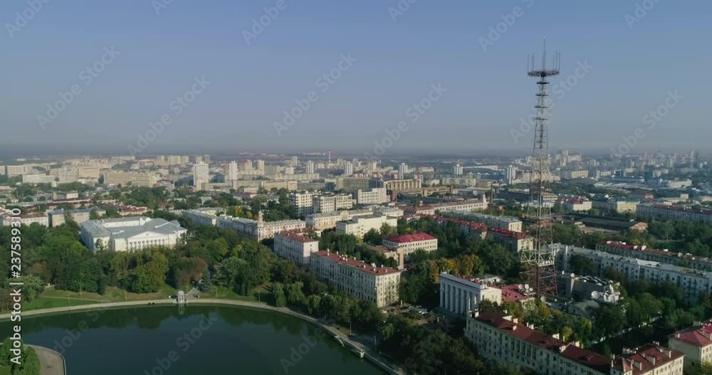 Summer morning in Minsk city. Aerial shot of the city center capital of Belarus, drone view of housing area, buildings, tv tower green trees park by the river