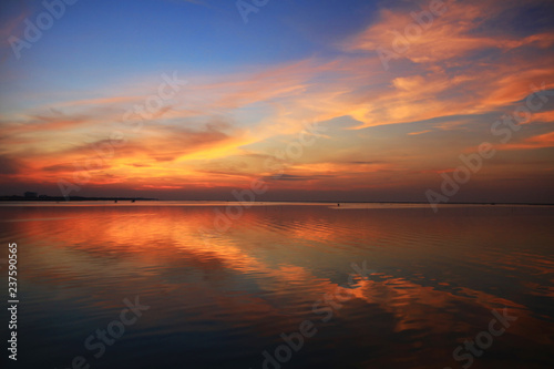 natural Dramatic orange sky and reflection on sea