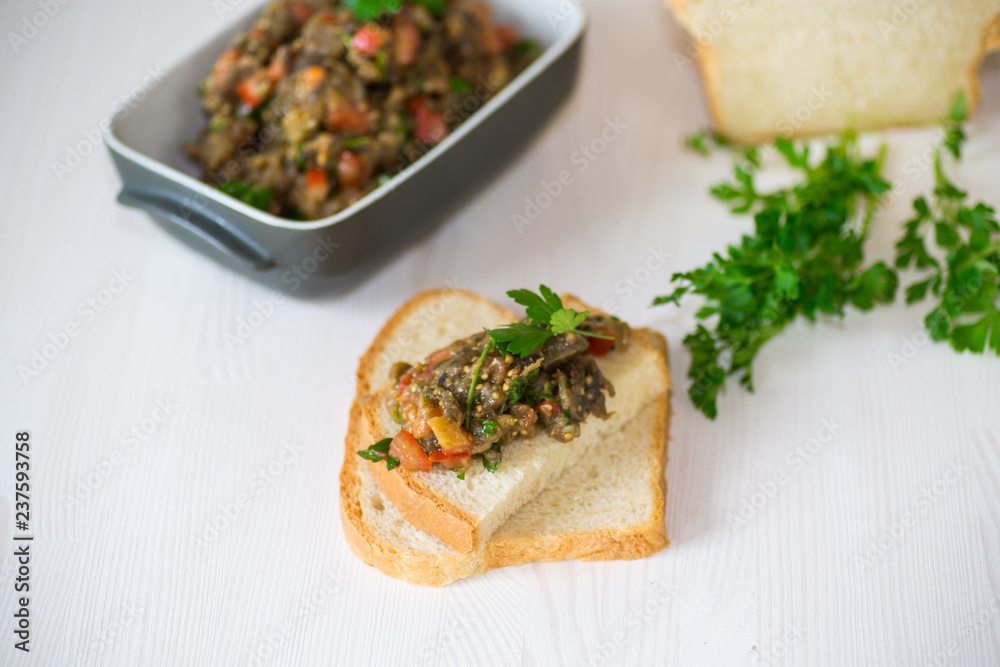 eggplant caviar with tomatoes and a slice of bread eggplant caviar with tomatoes and a slice of bread