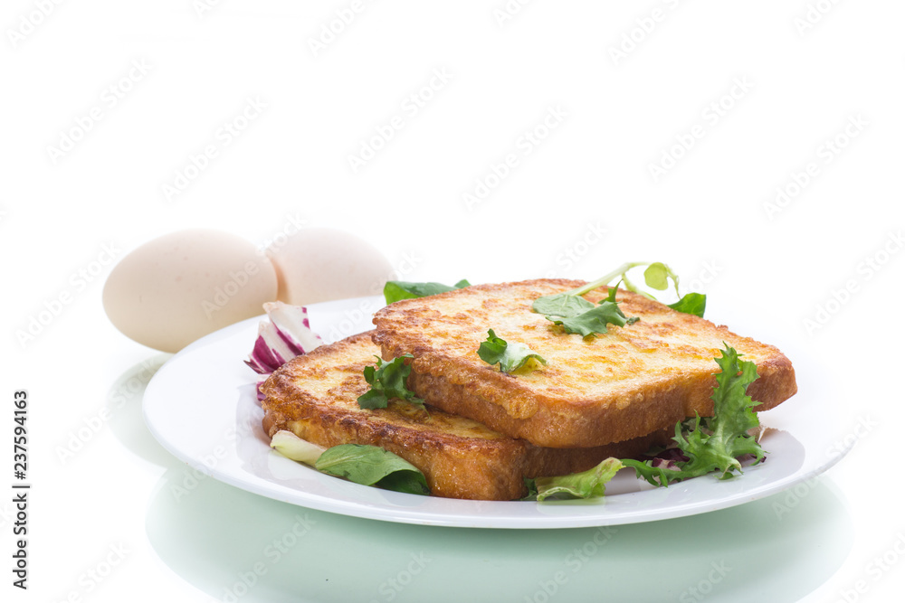 fried croutons in eggs with greens in a plate fried croutons in eggs with greens in a plate