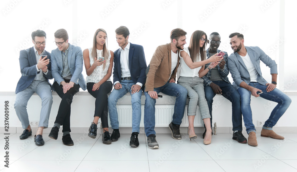 group of young people communicate in the waiting room.