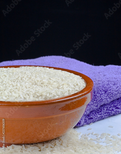 Bowl of rice and kitchen towel detail