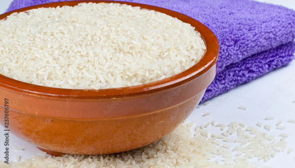 Bowl of rice and kitchen towel detail Bowl of rice and kitchen towel detail
