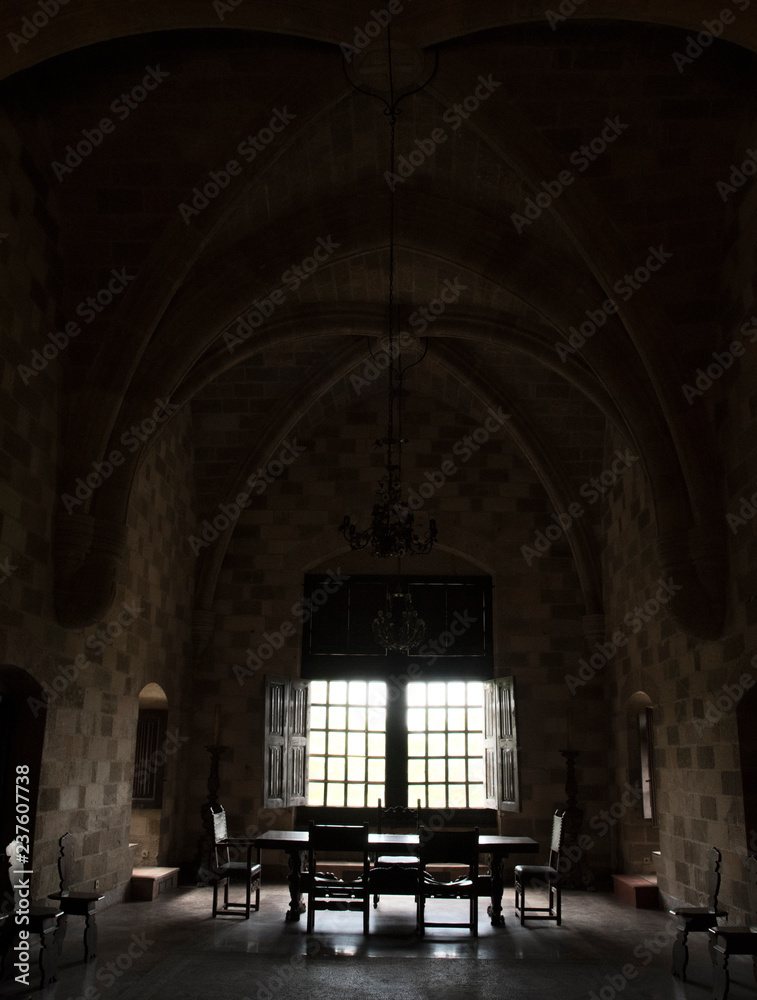 Abstract light shining through windows in old castle room