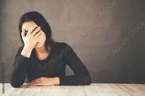 sad woman hand in face