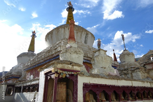 Stupas and prayer wheels in the Buddhist monastery in Lamayuru, Ladakh photo