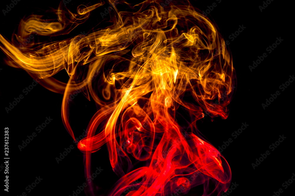 Obraz premium Colored smoke on black background