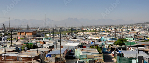 Panorama of Khayalitsha Township - the poorest slums - against the background of mauntains in Africa near Cape Town