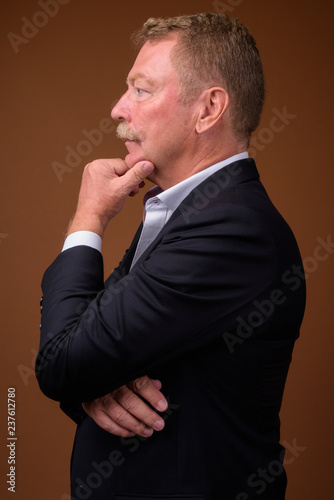 Profile view portrait of senior businessman thinking © Ranta Images