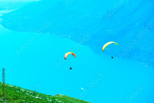 Fototapeta Naklejka Na Ścianę i Meble -  Paragliding over lake Garda in Italy