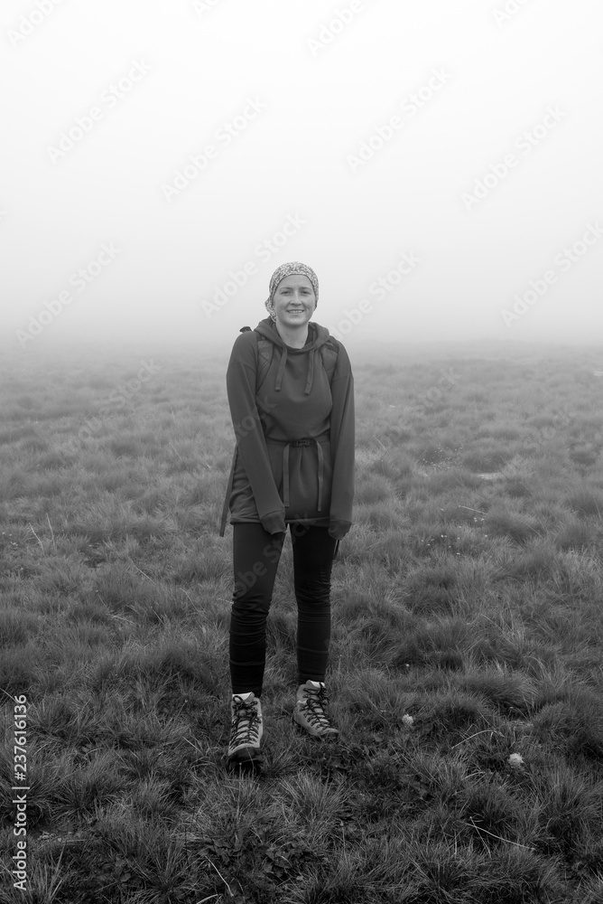 Woman hiker on the mountain enjoying