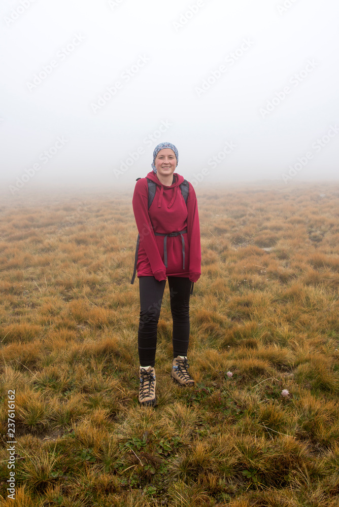 Woman hiker on the mountain enjoying