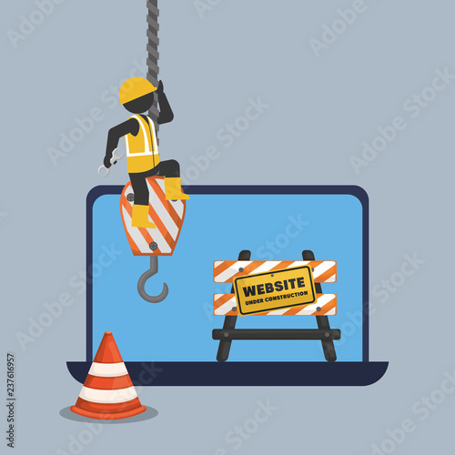 website under construction with laptop