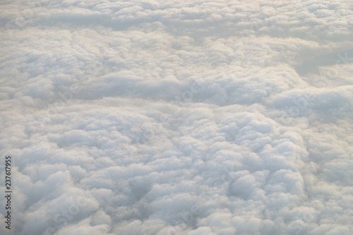 Soft and fluffy white clouds  view from the airplane above the sky