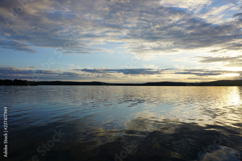 Beautiful lake with clouds and reflection in Finland