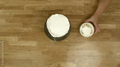 Spinning a Cake Around to Frost It