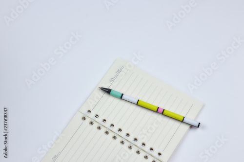 concept of recording your daily affairs. Notebook with pen on a white background. Copy space layout. place for text. view from above.