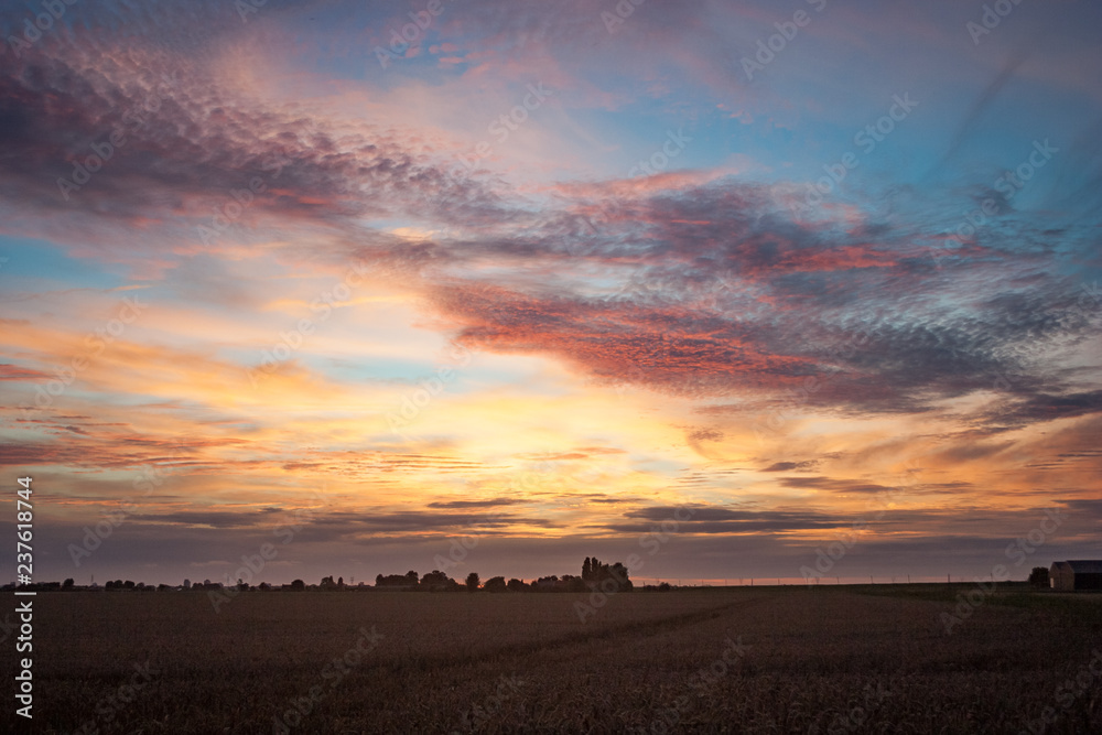 Colorful summer sunset over the dutch countryside