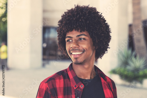 Happy african american hipster man with afro hairstyle