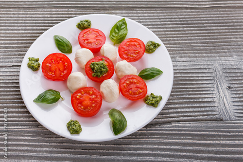 Caprese salad on a wooden rustic background