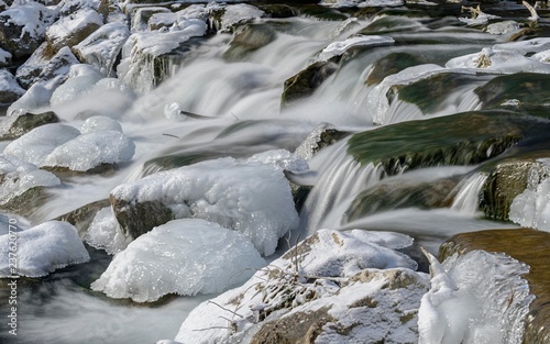 Ice-covered stones in the river bed of the Triesting, Pottenstein, Lower Austria, Austria, Europe photo