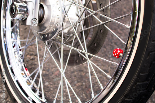motorcycle tire with an interesting touch of a red dice
