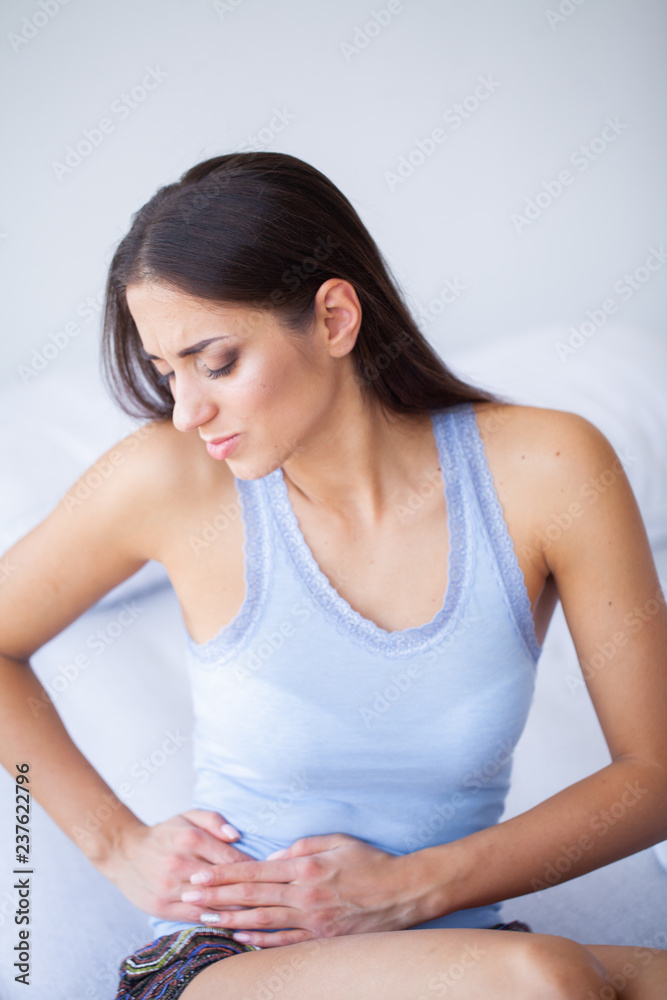 Pain stomach. Woman having painful stomachache,Female suffering from abdominal pain Pain stomach. Woman having painful stomachache,Female suffering from abdominal pain