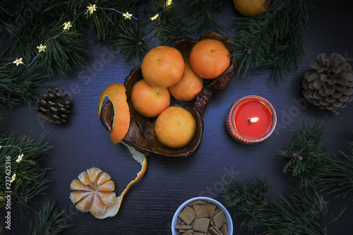 Mandarins in flat lay. Mandarins in still life composition for christmas. Clementines and christmas decorations