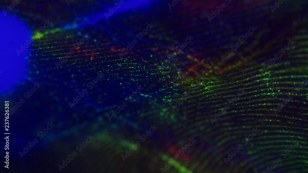 Macro skin, according to the folds of which flowing paint.