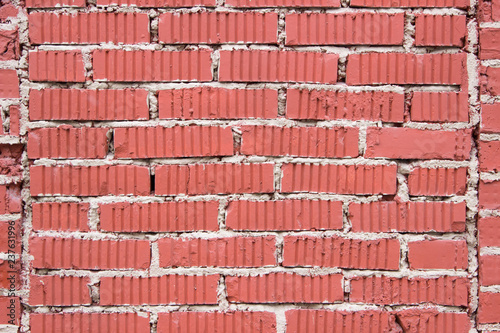 textured red brick wall of an old manufactory building