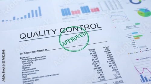 Quality control approved, hand stamping seal on official document, statistics photo